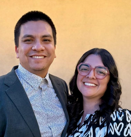 Olive’s parents standing together